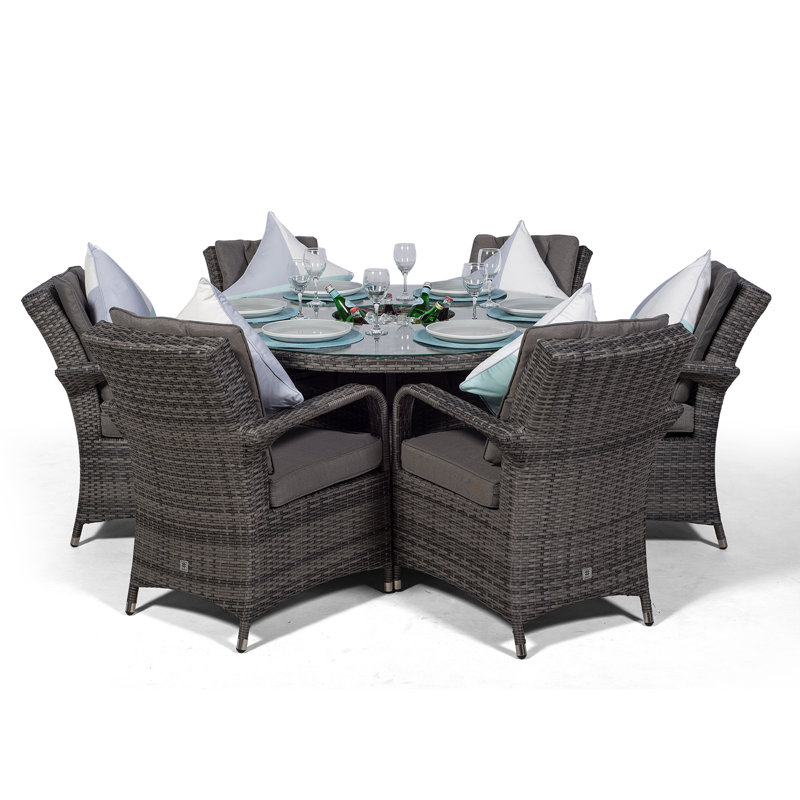 Karas 6 - Person Wicker Patio Dining Set with Round Table , Cushions Included, Grey