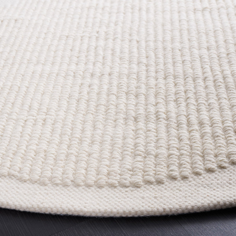 Charvik Solid Color Handmade Area Rug in Ivory, Round 6'