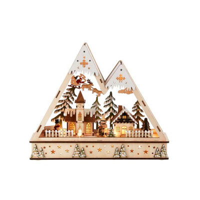 Village de montagne en bois avec père Noël