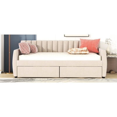 Lit de jour simple rembourré beige avec tiroirs pratiques et base spacieuse en lattes de bois pour un cadre de rangement fiable