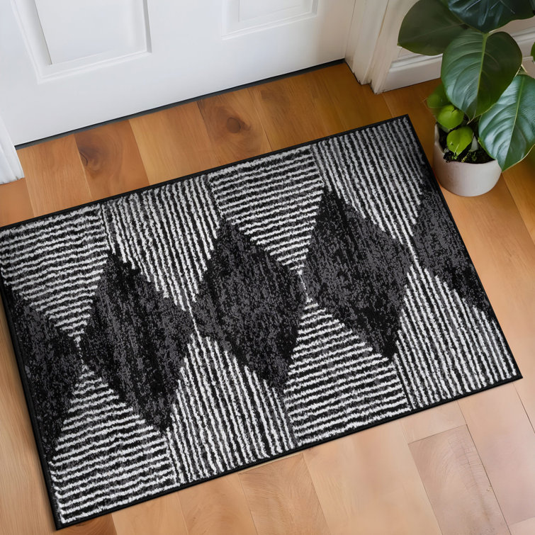 Tapis noir à rayures géométriques ivoire