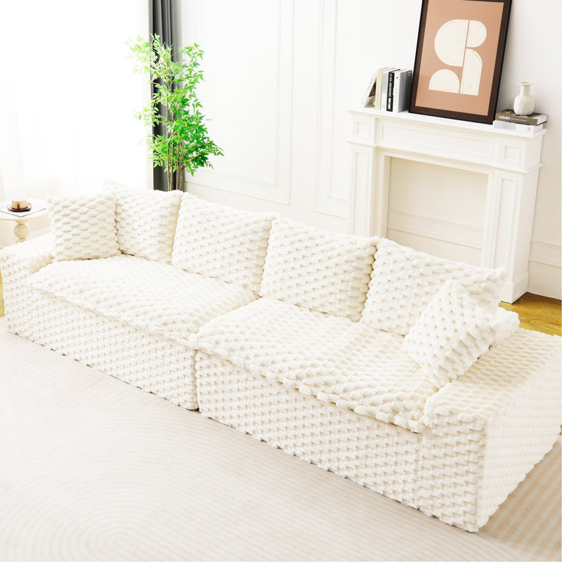 Canapé quatre places en velours blanc tortue, multifonctionnel et modulable, confortable et luxueux, pouvant supporter jusqu'à 180 kg, idéal pour la décoration intérieure.