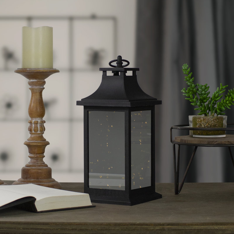 Lanterne 12 "à DEL noire à piles avec lumière vacillante