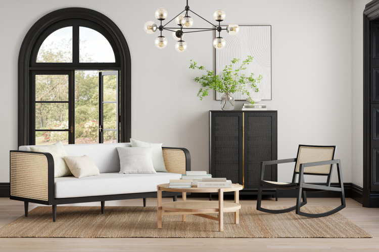 neutral round coffee table with stacks of books
