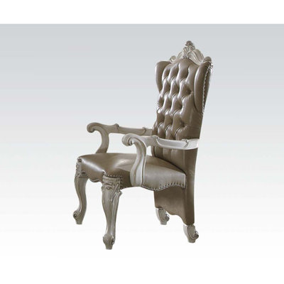 Fauteuil capitonné brun foncé Karlo