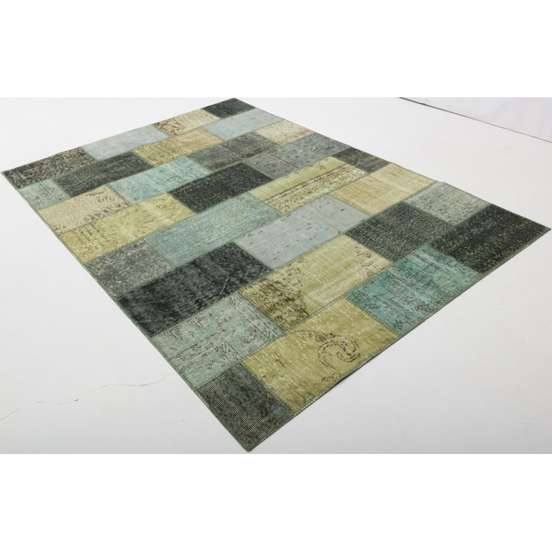 Tapis vert en coton noué à la main