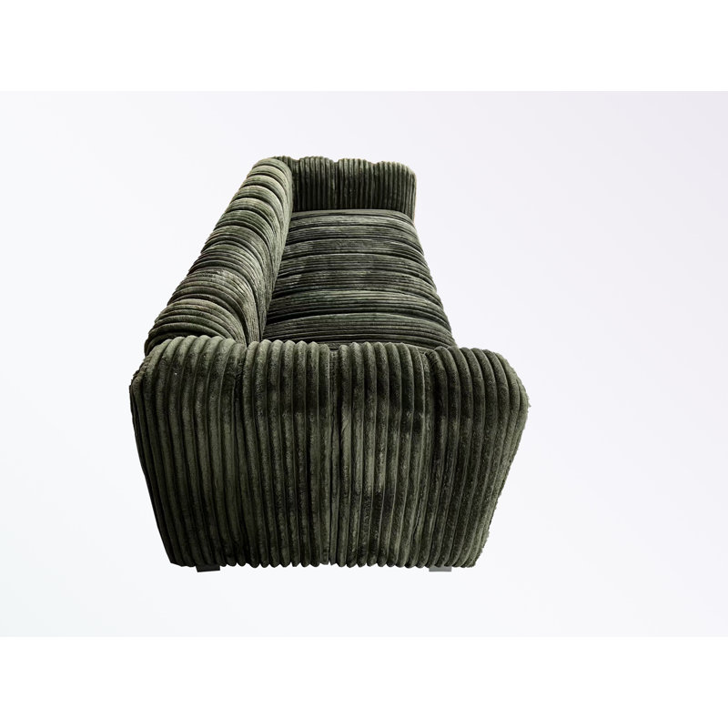 corduroy sofa with pillows and sturdy legs, Green