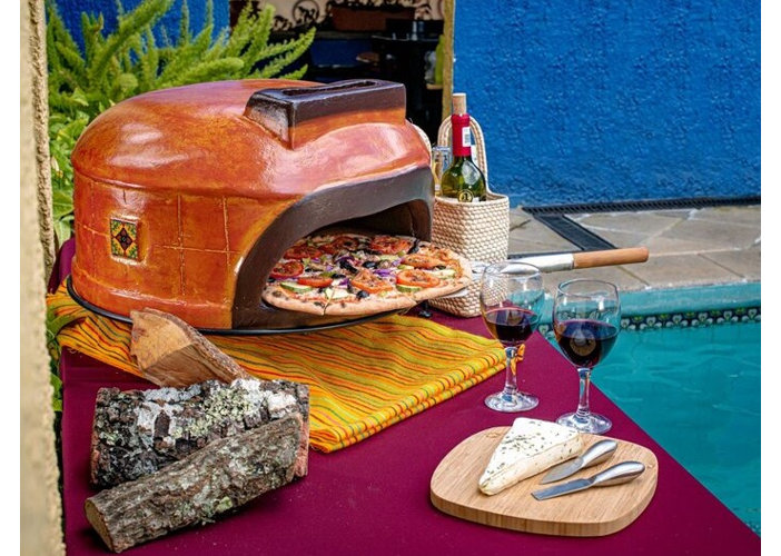 clay dome-shaped outdoor pizza oven