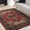 Tapis oriental rouge et noir tissé au métier mécanique Bratton
