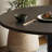 Round unique rotating leg dining table set-112652589