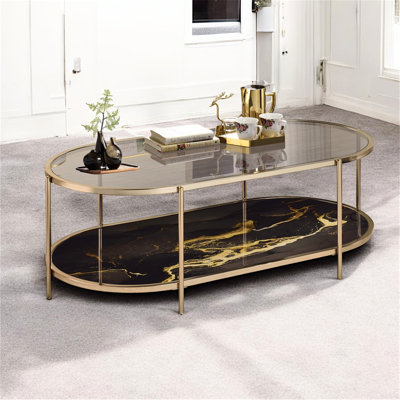 Table basse à finition marbre noir, verre et champagne