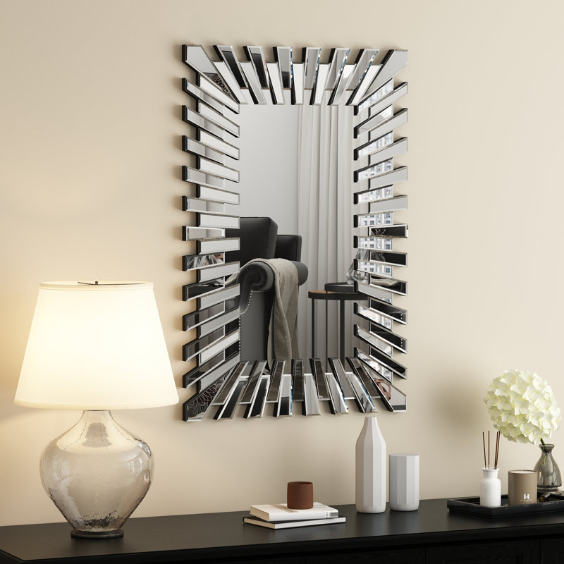 Ensemble console et miroir mural Amla en verre miroir avec pieds en forme de W : style ultramoderne, contemporain et glamour.