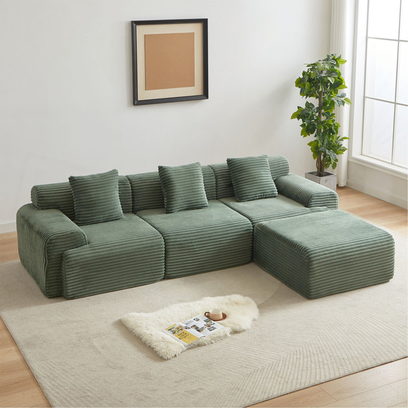 Canapé modulaire en velours côtelé de 114 pouces avec un design structurel incrusté, trois coussins décoratifs, un dossier plus large et quatre modules librement configurables.