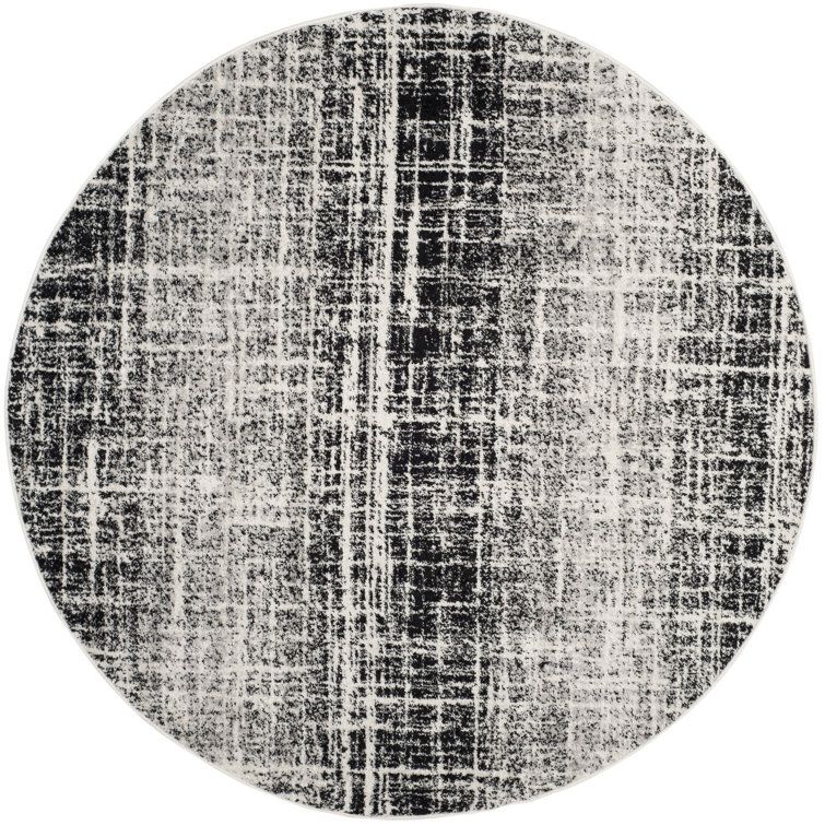 Riebe Black Area Rug