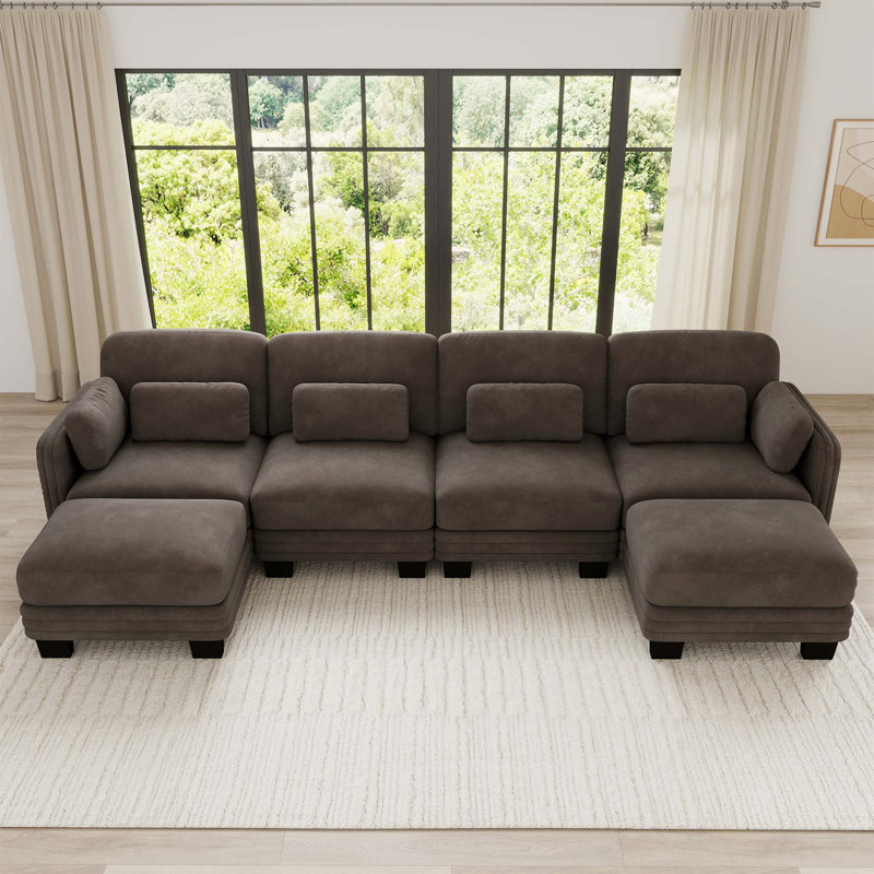 Canapé d'angle modulaire capitonné avec poufs amovibles