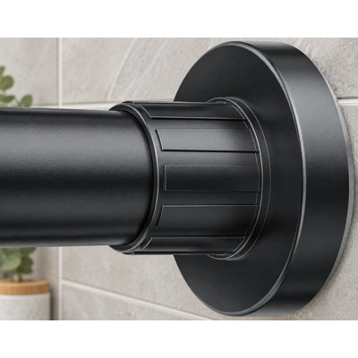 This heavy-duty black bathroom shower rod uses a telescopic spring-tension design that adjusts from 32-80 inch, installs without drilling, is rustproof, and provides a non-slip hold.