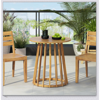 Table de salle à manger d'extérieur à plateau rond en bois d'acacia, parfaite pour les réunions de famille et les repas en plein air avec charme rustique et résistance aux intempéries