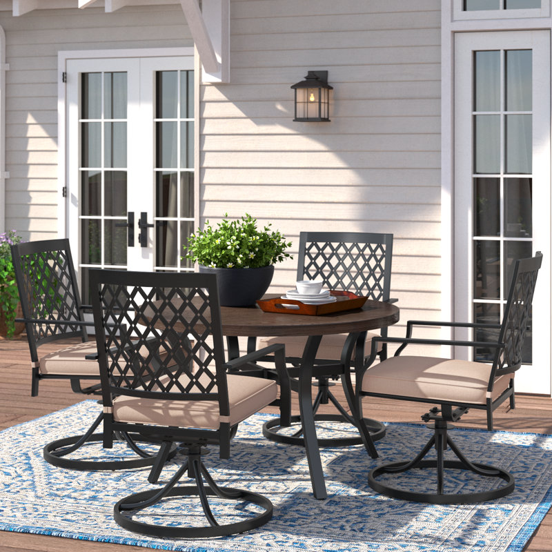 Leonard 4 - Person Patio Dining Set with Round Table , Cushions Included