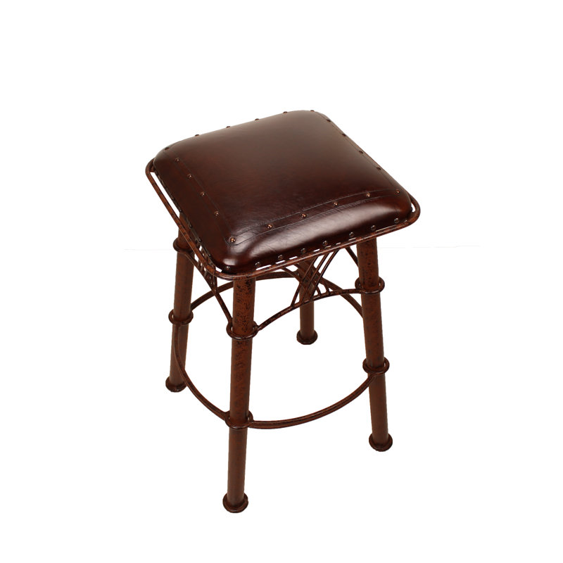 Tabouret 30 "Montana, Motif brun antique / uni avec têtes de clou