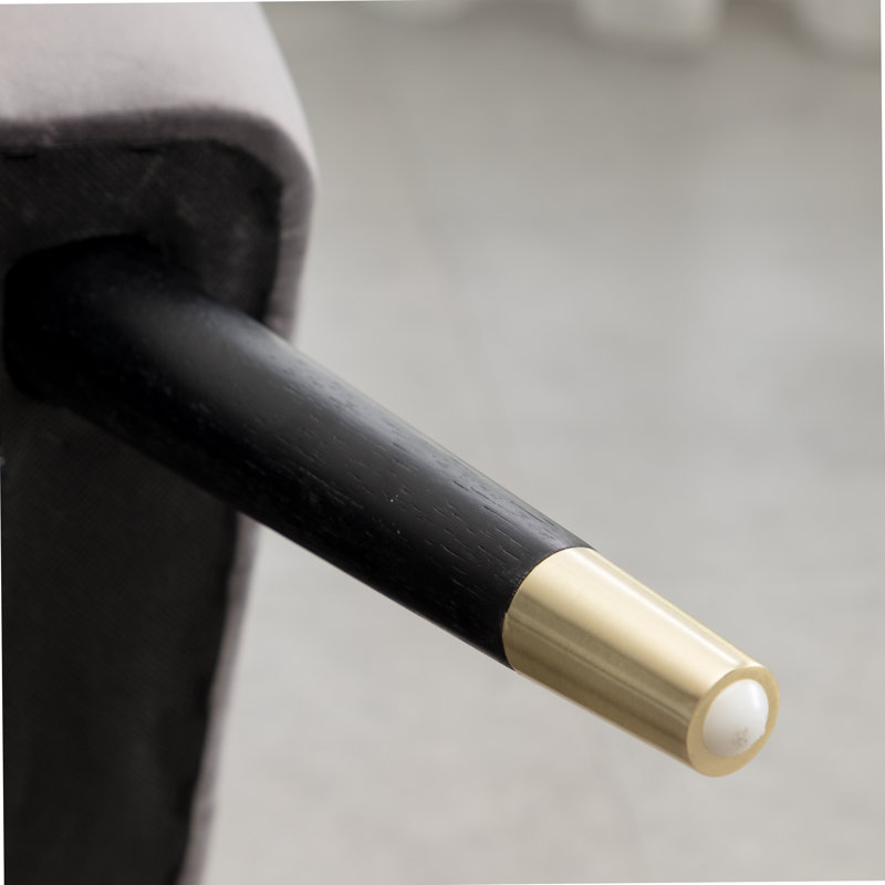 Fauteuil d'appoint contemporain en velours rembourré de mousse dense et au design unique, idéal pour améliorer le confort d'assise et l'esthétique de la pièce