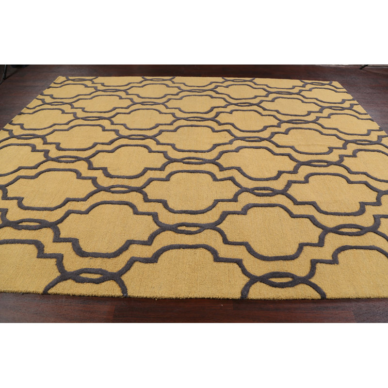 Tapis géométrique doré en laine touffeté à la main