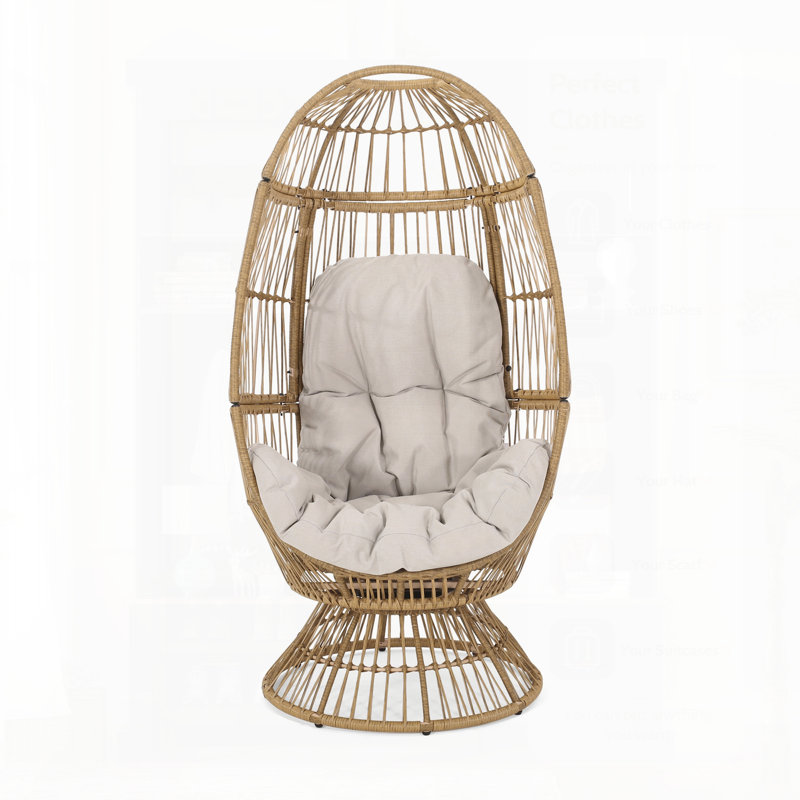 Fauteuil à œufs pivotant Reseda, siège d'extérieur confortable en osier résistant aux intempéries et coussins confortables pour la détente.