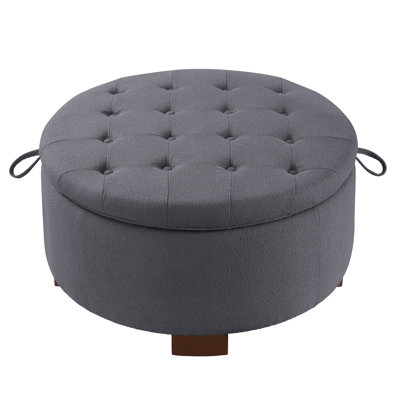 Round modern upholstered ottoman with reversible seat cushion for living room; bedroom
