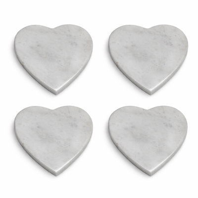 nusteel 4" Heart Shaped White Marble Coasters (Set of 4) are crafted from genuine natural stone, combining durability with elegance. Designed to protect surfaces from spills and stains, they enhance any kitchen counter, table with a sleek, luxurious touc