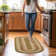 Bryiana Farmhouse Braided Jute Green Area Rug