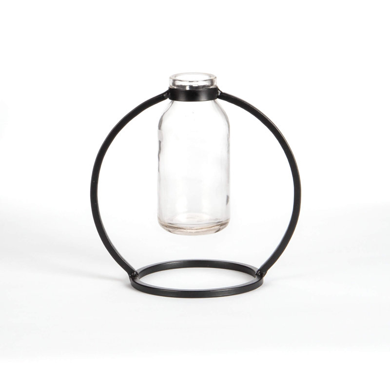 Vase en verre sur pied en métal rond