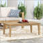 Table basse d'extérieur en bois d'acacia durable avec un design rustique et une finition résistante aux intempéries, parfaite pour le patio et le jardin