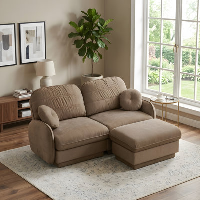 Canapé en L avec assise profonde et repose-pieds amovible