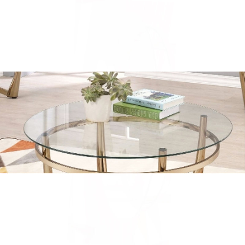 Table basse en verre transparent et finition champagne