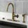 Kingston Brass Webb Single-Handle 1-Hole Deck Mount Kitchen Faucet with Knurled Handle and Brass Side Sprayer