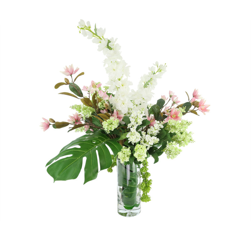 Arrangement delphinium, magnolia et lilas