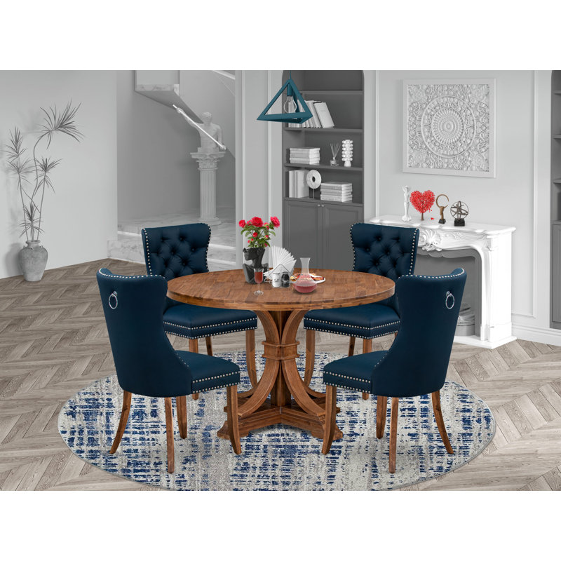 L'ensemble de salle à manger 5 pièces comprend une table ronde avec piédestal et 4 chaises rembourrées en tissu de polyester vert saule, noir sablé
