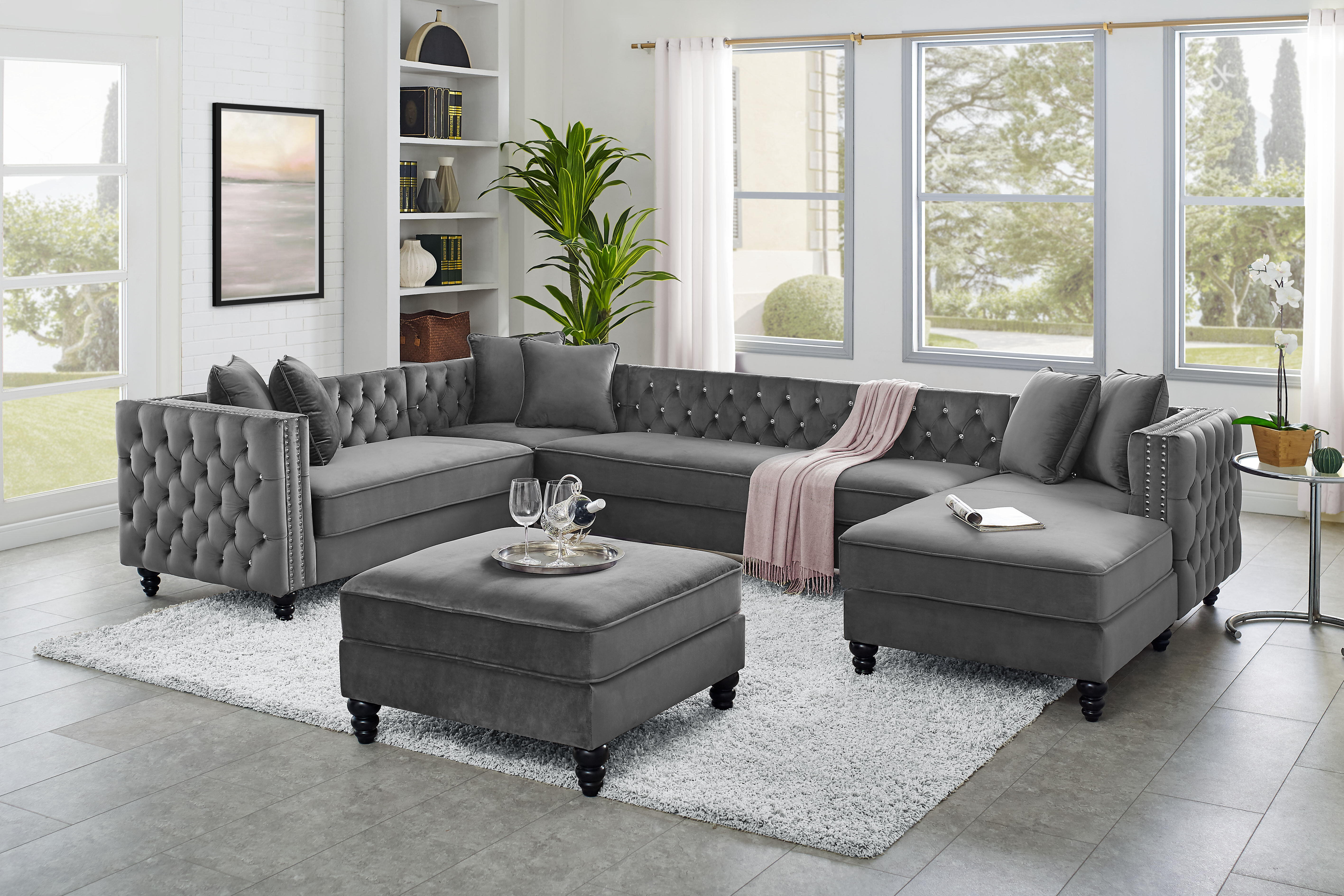 Tufted grey reversible sectional on sale with nailhead trim