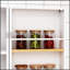 Armoire de cuisine spacieuse avec tablettes et portes réglables pour un rangement polyvalent et une organisation élégante