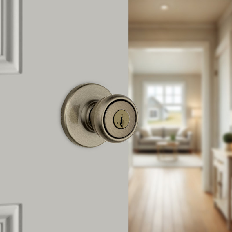 Tylo Keyed Entry Knob featuring SmartKey Security, Antique Brass