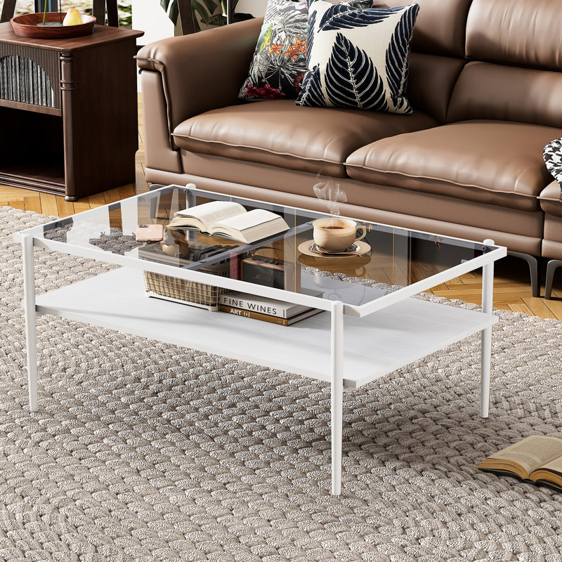Table basse en verre trempé gris avec pieds blancs, plateau fonctionnel et élégant avec pieds robustes
