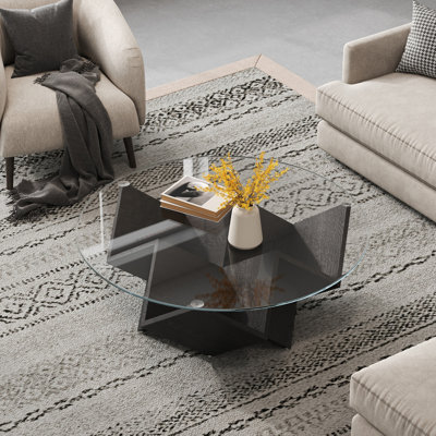 Table basse ronde avec plateau en verre et tablettes de rangement géométriques