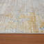 Tapis doré à motif abstrait Brazell-1244046287