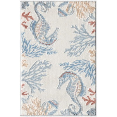Baeza Animal Print Ivory/Blue/Red Area Rug