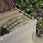 Suncast 78 Gallon Water Resistant Resin Deck Box with Wheels in Light Taupe/Mocha