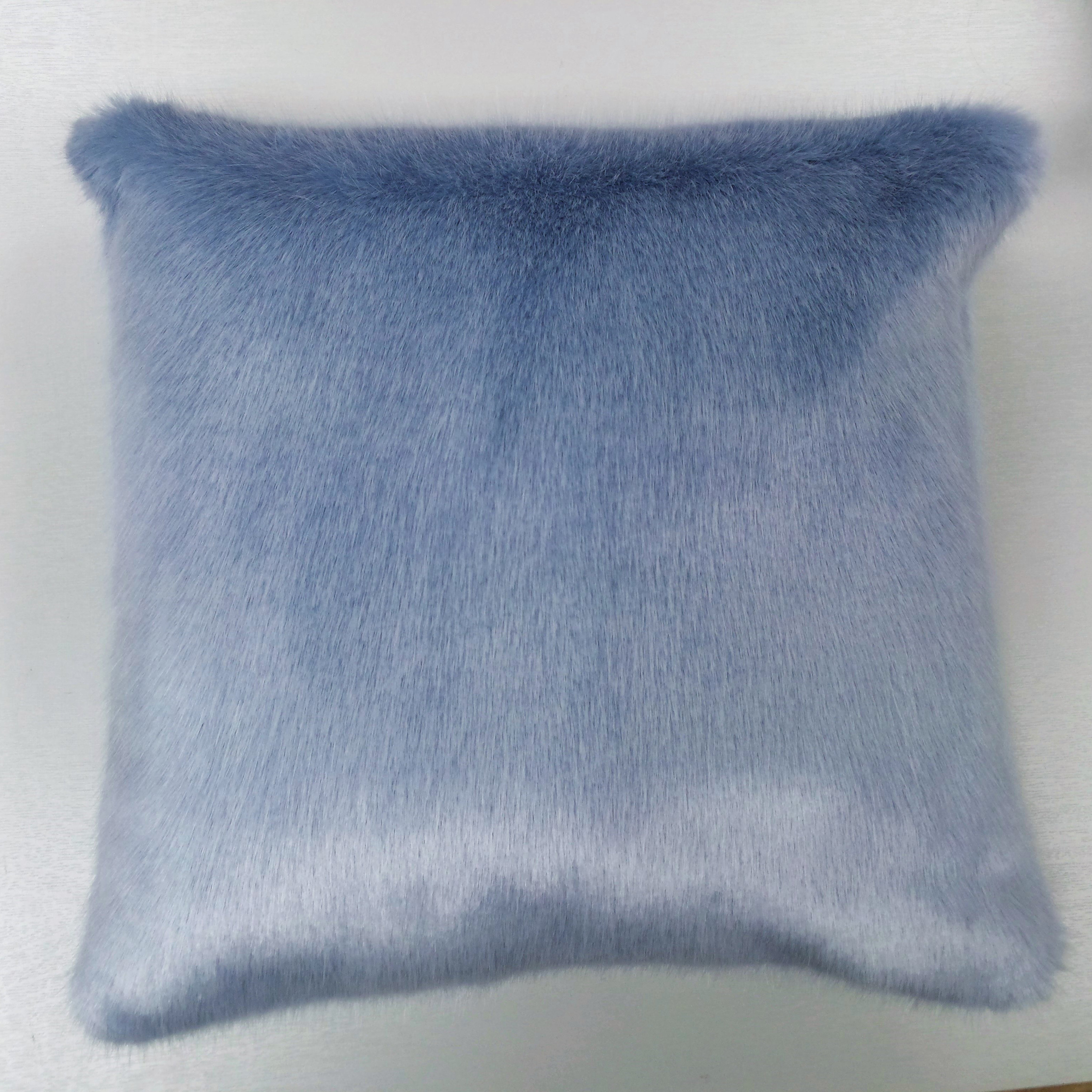 Light blue faux outlet fur pillow