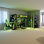 Cadre de lit de jeu simple en L en forme de L avec lumières à DEL RVB, lits simples doubles, ports USB, meuble télé et tablettes de rangement, aménagement réversible, lit mezzanine en bois peu encombrant pour adolescents et adultes