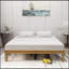 Structure de lit plateforme en bois robuste pour grand lit, rehaussant le confort et le style de la chambre à coucher