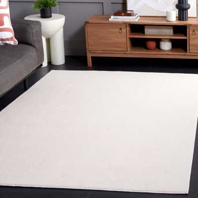 Tapis beige en polyester tissé à la machine Lukeus