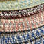 Tapis intérieur / extérieur rond en polypropylène tressé à la machine géométrique beige / gris Kemmy-181030466