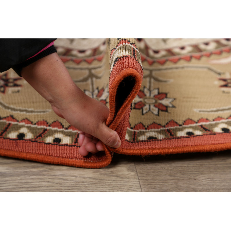 Tapis ivoire/rouge/brun rond oriental